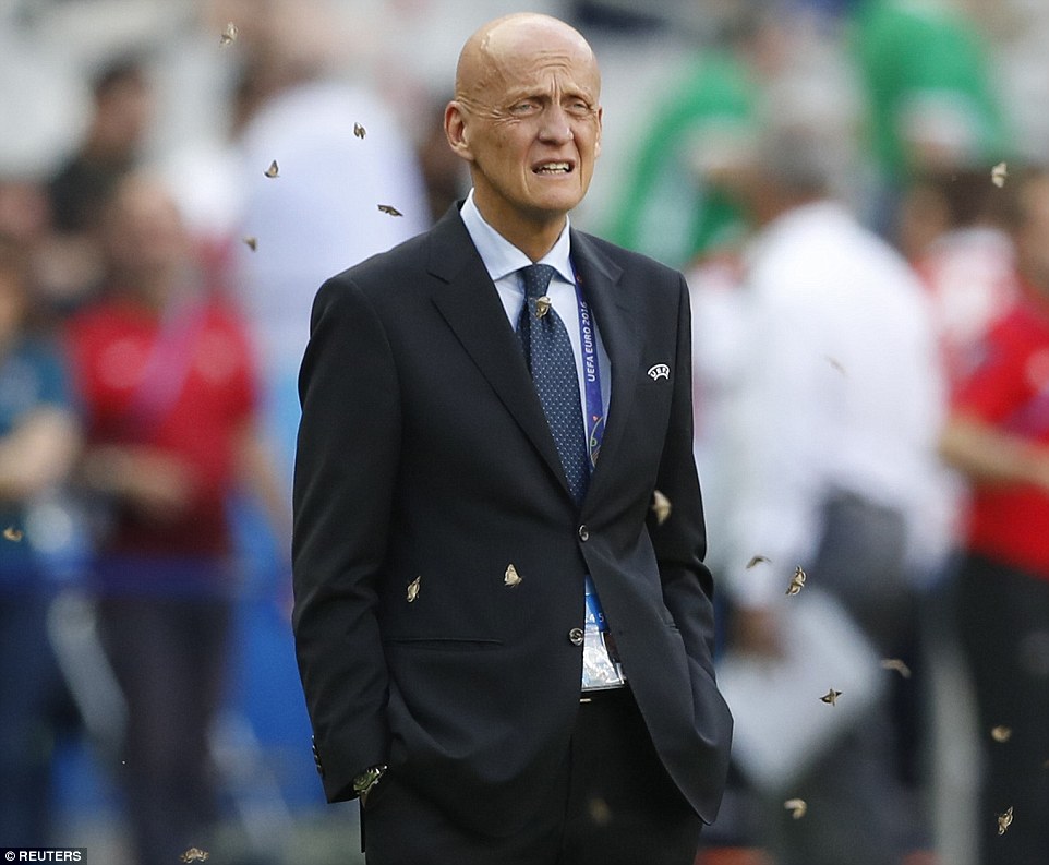 3622F73600000578-3683490-Collina_shows_his_disgust_as_moths_swarm_across_the_pitch_at_the-a-7_1468225804242